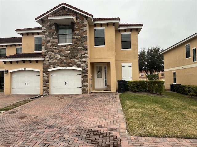 view of front facade with a garage and a front yard