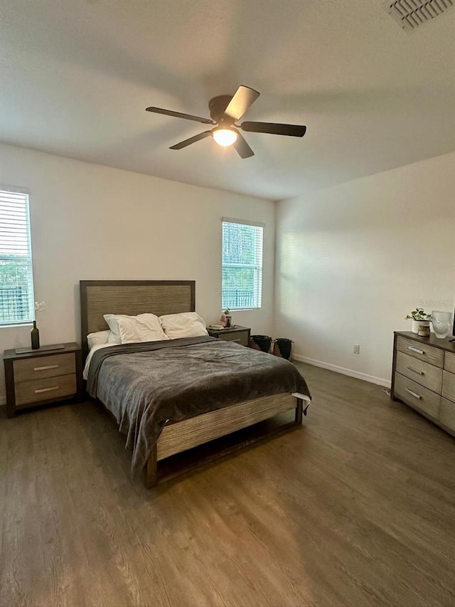 bedroom featuring dark wood-type flooring and ceiling fan