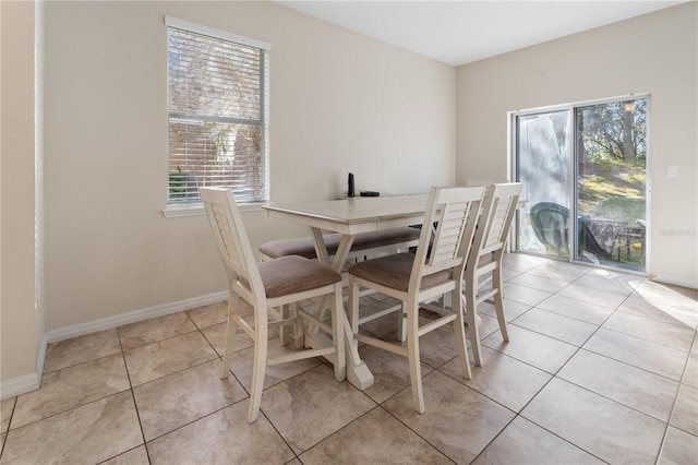 tiled dining space with a wealth of natural light