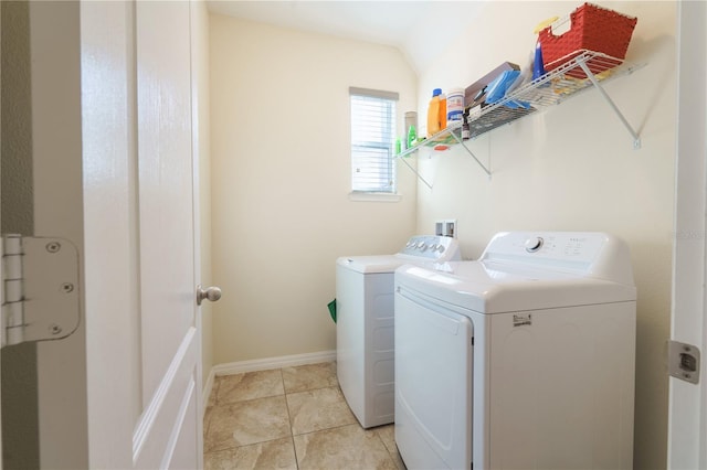 clothes washing area featuring independent washer and dryer and light tile patterned flooring