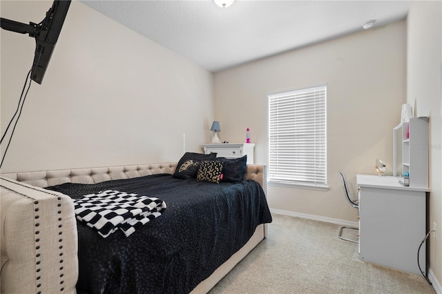 carpeted bedroom with vaulted ceiling