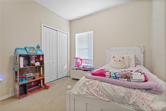 carpeted bedroom featuring a closet