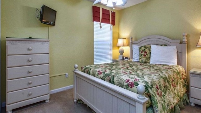 bedroom with ceiling fan and carpet floors