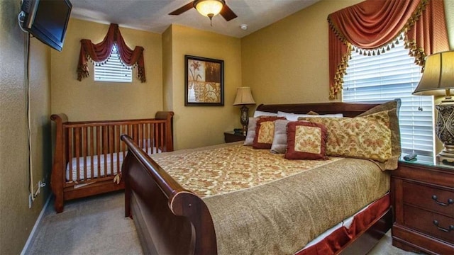 carpeted bedroom with ceiling fan