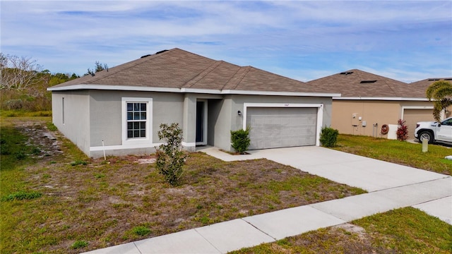 ranch-style home featuring a front lawn and a garage