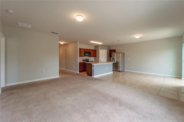 unfurnished living room featuring light tile patterned floors