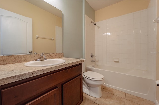 full bathroom with toilet, tile patterned flooring, tiled shower / bath combo, and vanity