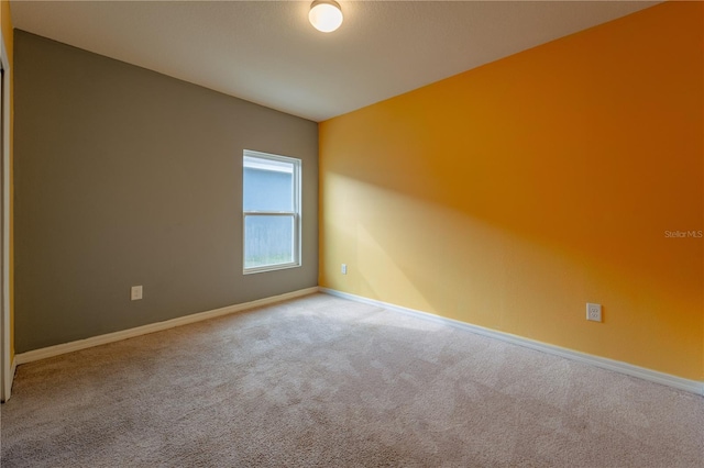 empty room with light colored carpet