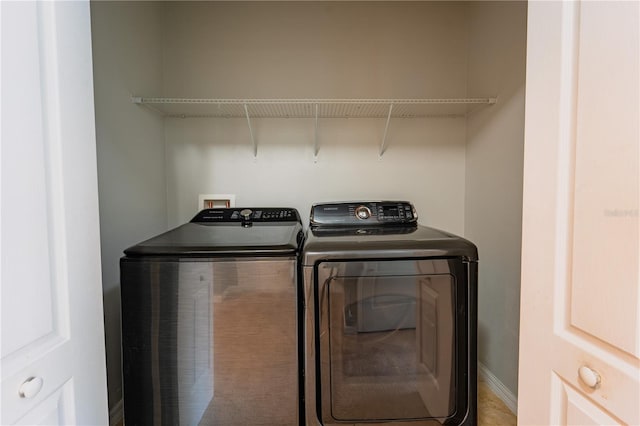 laundry room with independent washer and dryer