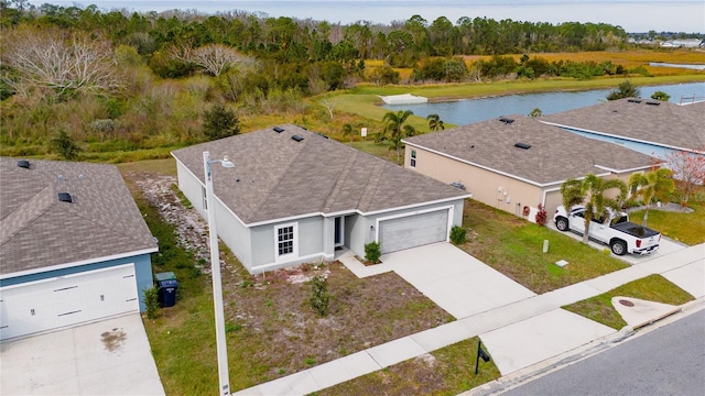 birds eye view of property with a water view