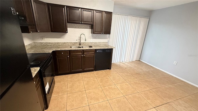 kitchen with sink, dark brown cabinetry, light tile patterned floors, and black appliances