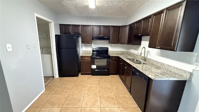 kitchen featuring black appliances, sink, light tile patterned flooring, a textured ceiling, and dark brown cabinets