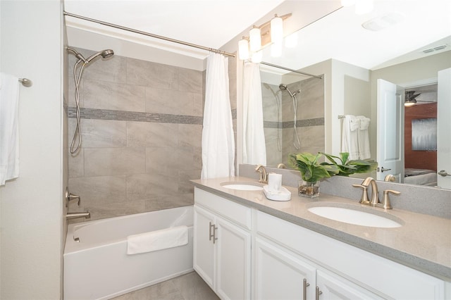 bathroom featuring vanity and shower / tub combo with curtain