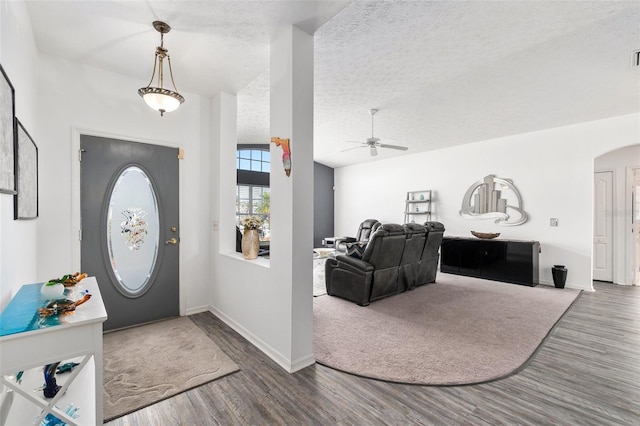 entrance foyer with ceiling fan, a textured ceiling, and hardwood / wood-style flooring