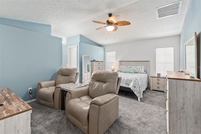 bedroom with ceiling fan, a textured ceiling, carpet floors, and vaulted ceiling