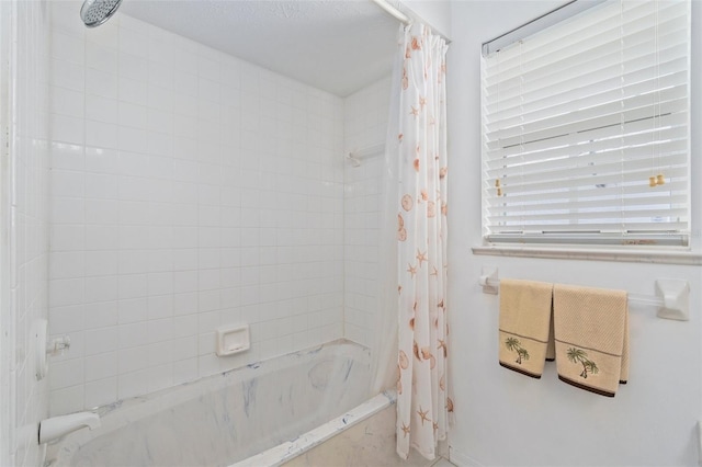 bathroom featuring shower / bathtub combination with curtain