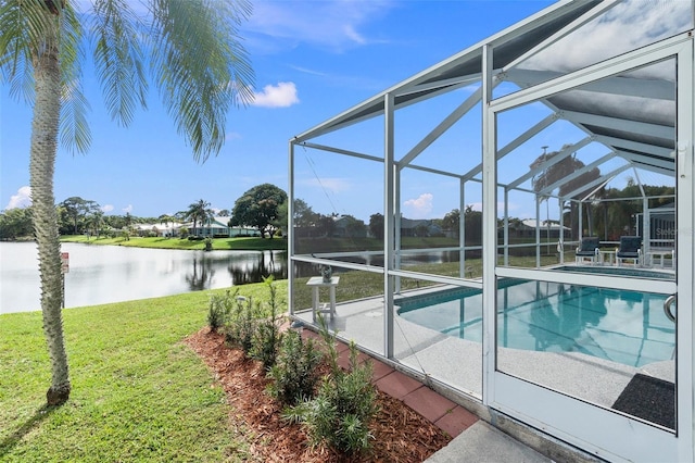 view of swimming pool featuring a lanai, a yard, and a water view