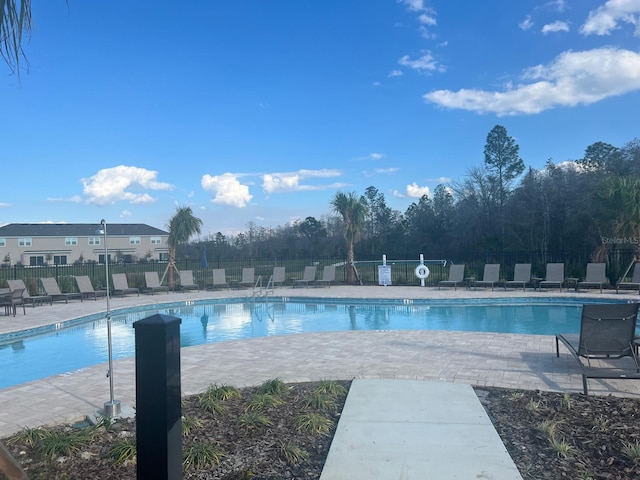 view of swimming pool with a patio