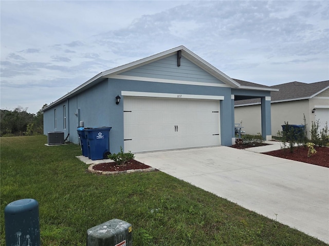 exterior space with a garage, central AC, and a front yard