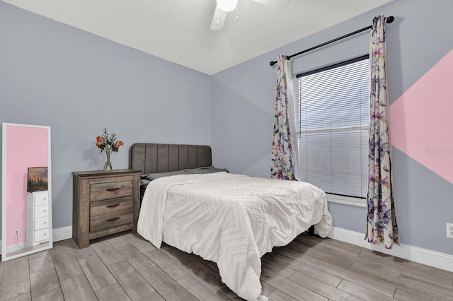 bedroom featuring ceiling fan and light hardwood / wood-style floors