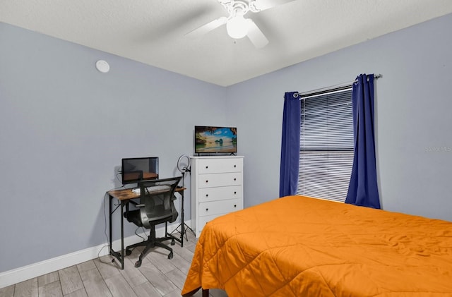 bedroom featuring ceiling fan and light hardwood / wood-style floors