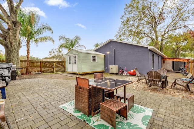 view of patio / terrace with a shed