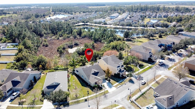 aerial view with a water view and a residential view