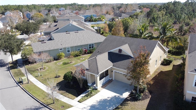 birds eye view of property with a residential view