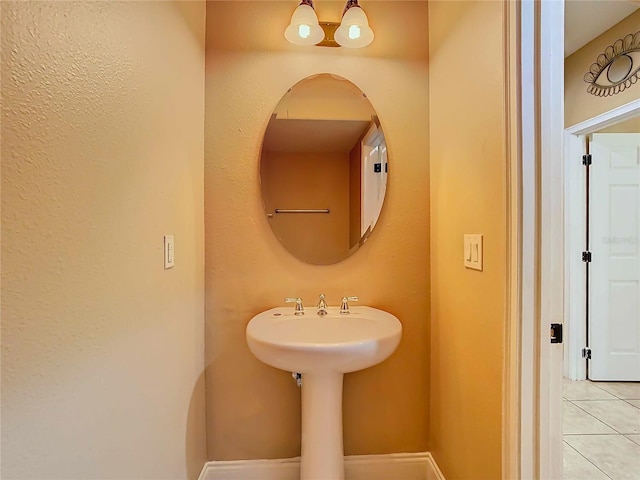 bathroom with tile patterned floors