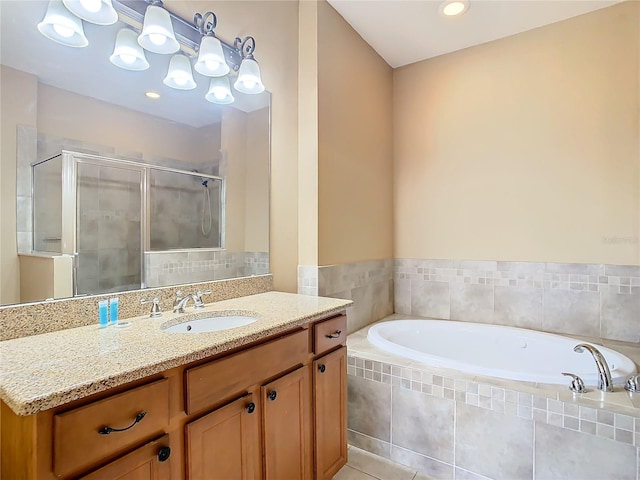 bathroom featuring vanity, tile patterned floors, and plus walk in shower