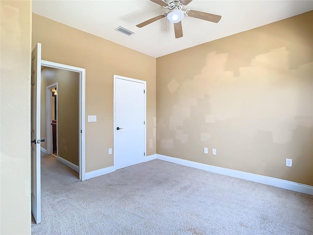 unfurnished bedroom with light carpet and ceiling fan