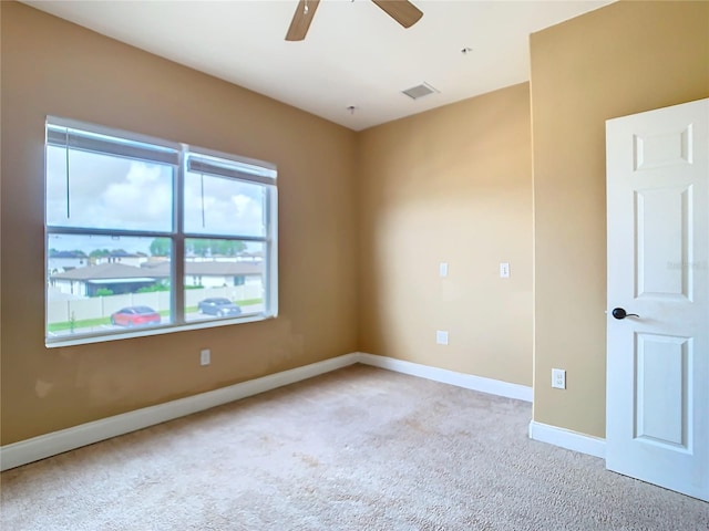 carpeted empty room with ceiling fan