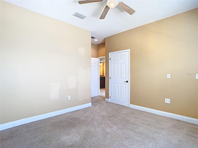 carpeted empty room with ceiling fan