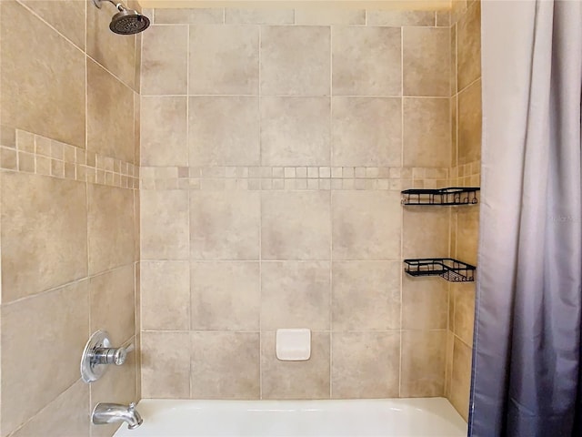 bathroom with shower / bath combination with curtain