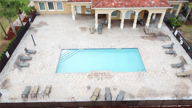 view of pool featuring a patio