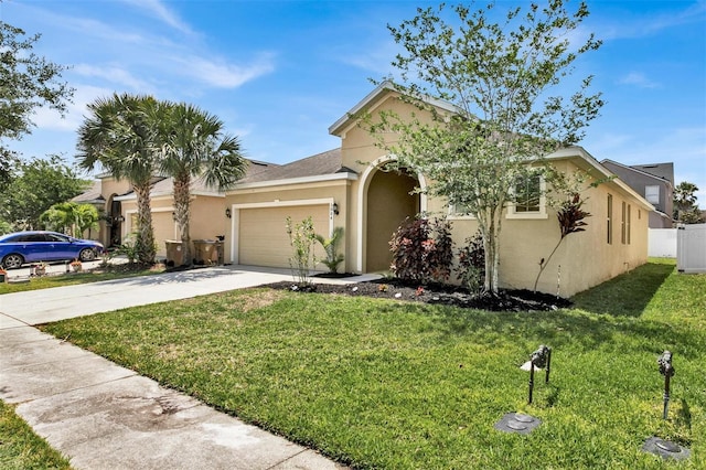 view of front of home with a garage and a front yard