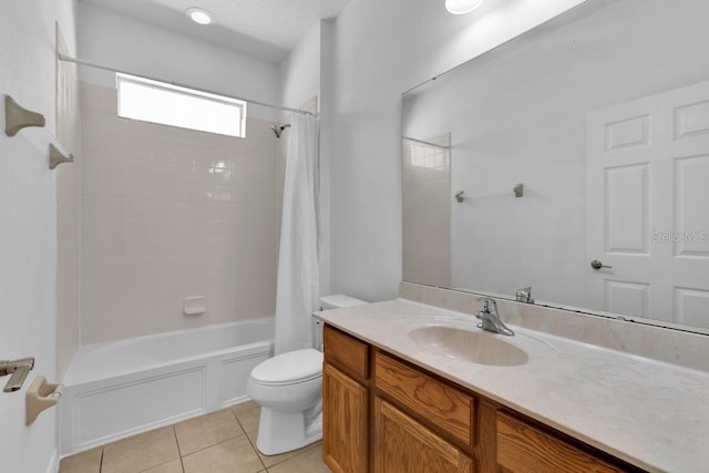 full bathroom with toilet, vanity, tile patterned floors, and shower / tub combo with curtain