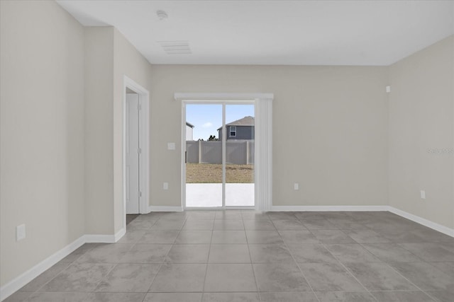 unfurnished room with light tile patterned floors