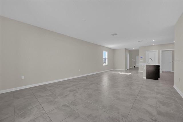 spare room with light tile patterned floors