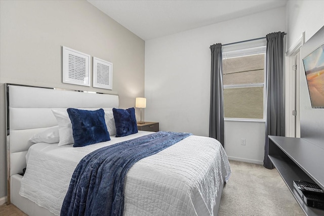 bedroom featuring light carpet