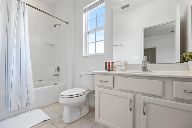 full bathroom with plenty of natural light, toilet, shower / tub combo with curtain, and tile patterned flooring