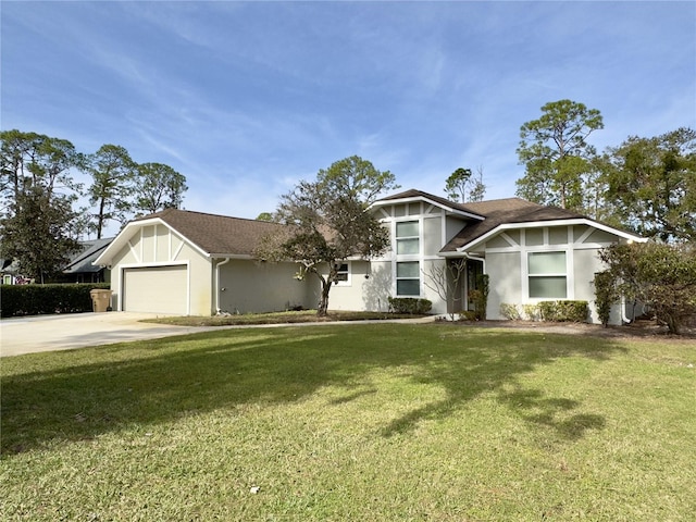 view of front of home featuring a garage and a front yard