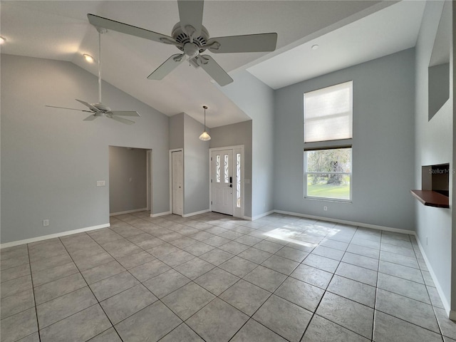 unfurnished living room featuring light tile patterned floors and lofted ceiling