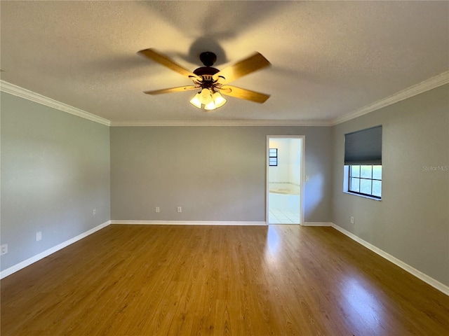 empty room with ceiling fan, ornamental molding, hardwood / wood-style floors, and a textured ceiling