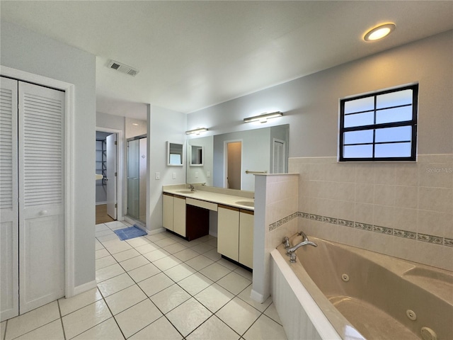 bathroom with vanity, shower with separate bathtub, and tile patterned flooring