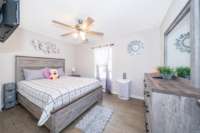 bedroom featuring light hardwood / wood-style flooring and ceiling fan