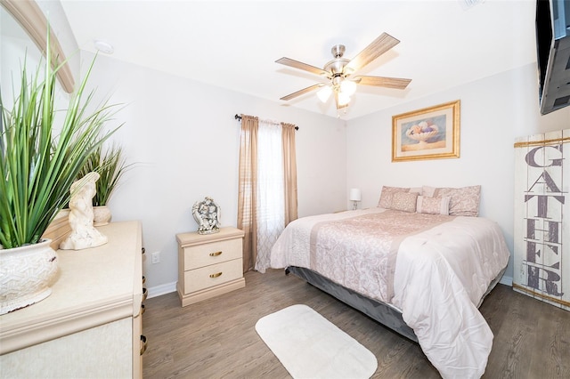 bedroom with dark wood-type flooring and ceiling fan