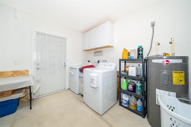 laundry area with water heater, cabinets, and washing machine and clothes dryer