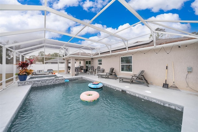 view of swimming pool featuring a lanai, a patio area, and an in ground hot tub