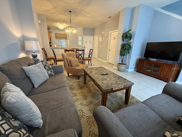 living room with a notable chandelier and light tile patterned flooring